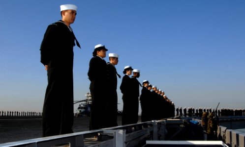 US Navy 071105-N-0455L-003 Sailors aboard Nimtiz-class aircraft carrier USS Harry S. Truman (CVN 75) man the rails as the ship moves through Chesapeake Bay