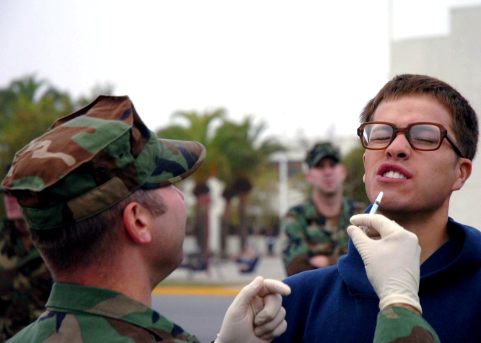 US Navy 071107-N-0775Y-005 Hospital Corpsman Chief Robert Bott administers a flu mist nasal spray vaccine to Utilitiesman 3rd Class Anthony Mezlak during a battalion-wide immunization day at Port Hueneme