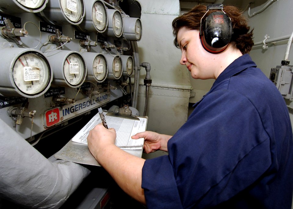 US Navy 071106-N-8132M-027 Machinist's Mate 1st Class Karin Thomas takes high-pressure air compressor readings inside the O2N2 lab aboard nuclear-powered aircraft carrier USS Enterprise (CVN 65)