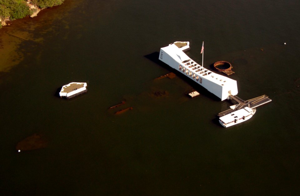 US Navy 071108-N-4965F-318 A U.S. Navy white boat sits moored at the pier of USS Arizona Memorial while visitors pay tribute to the fallen Sailors and Marines of USS Arizona (BB 39)
