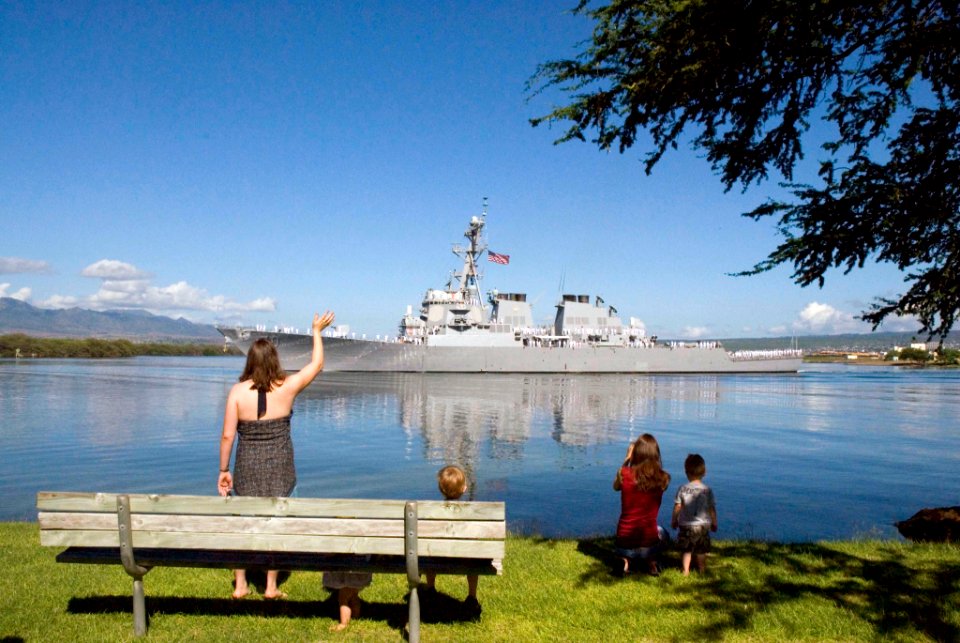 US Navy 071112-N-6674H-008 Family and friends wave farewell to Sailors aboard guided-missile destroyer USS Hopper (DDG 70) as she departs Naval Station Pearl Harbor for deployment