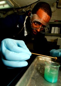 US Navy 071112-N-8132M-013 Electrician's Mate 3rd Class George Howthorne performs a jacket water cooling test inside the auxiliary diesel shop aboard the nuclear-powered aircraft carrier USS Enterprise (CVN 65)