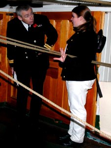 US Navy 071106-N-2893B-001 Seaman Katherine Wood gives a tour of the steerage area aboard USS Constitution to Lt. Cmdr. John Scivier, commanding officer of HMS Victory