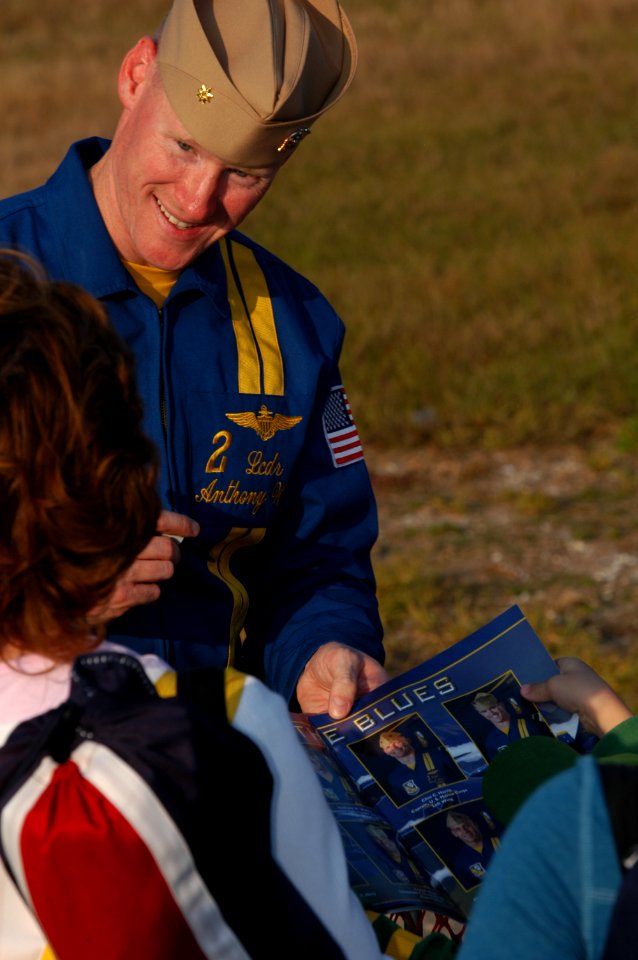 US Navy 071110-N-5328N-910 Blue Angels No. 2 pilot Lt. Cmdr. Anthony W. Walley signs autographs for fans at Sherman Field
