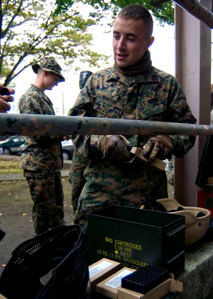 US Navy 071106-N-5253W-006 Sgt. Greg Martin assigned to the 1st Fleet Anti-terrorism Security Team (FAST), 3rd Platoon load magazines with training rounds during advanced urban combat training on board Commander Fleet Activiti