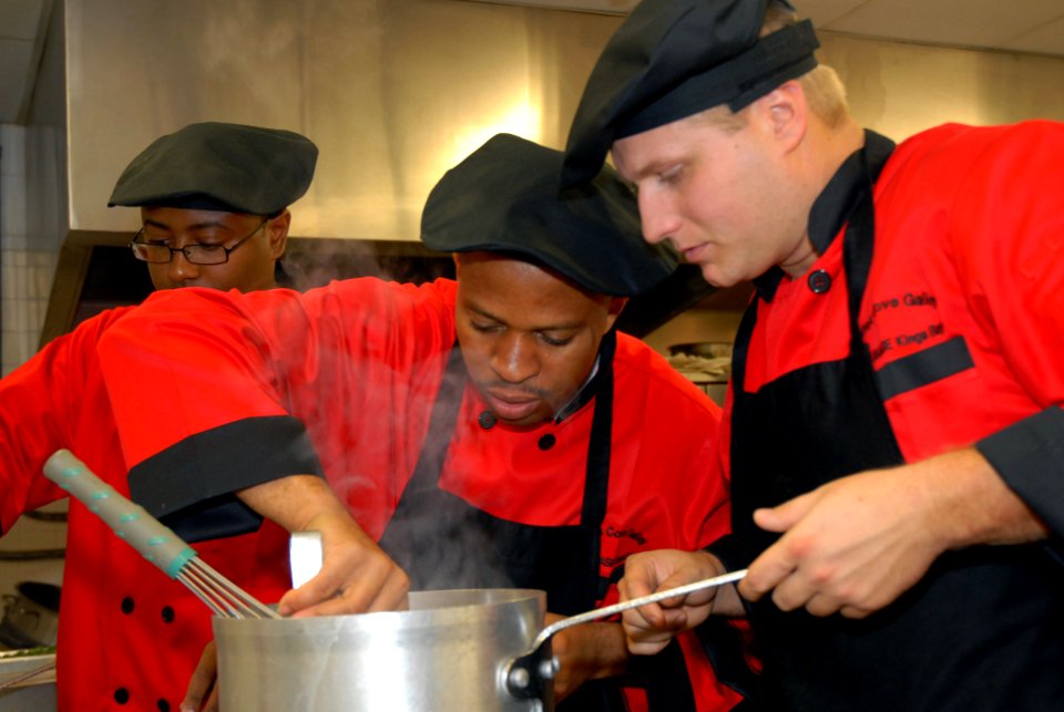 US Navy 071113-N-8102J-198 Team members assigned to Naval Submarine Base Kings Bay, Ga., work together to create one of three dishes they are require to make using potatoes