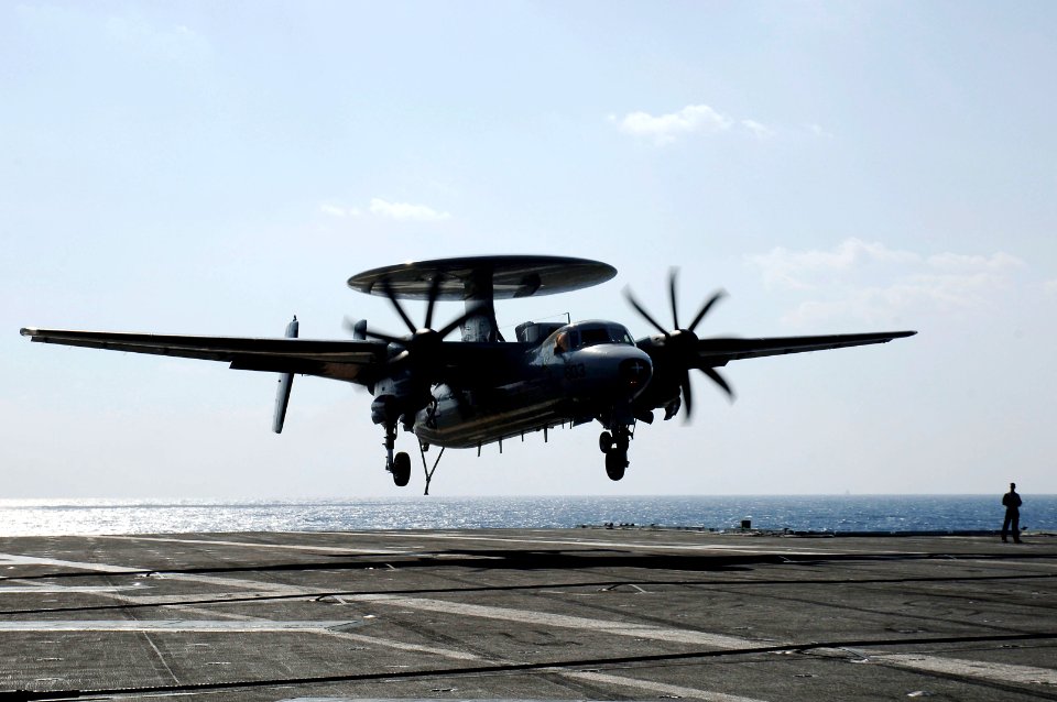 US Navy 071112-N-3136P-031 An E-2C Hawkeye, assigned to Carrier Airborne Early Warning Squadron (VAW) 115, prepares to make a landing aboard the aircraft carrier USS Kitty Hawk (CV 63)