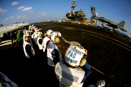 US Navy 071115-N-7883G-043 Japan Self-Defense Forces (JSDF) personnel observe flight operations aboard the nuclear-powered aircraft carrier USS Kitty Hawk (CV 63)