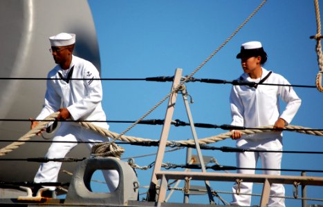US Navy 071112-N-0879R-001 Sailors aboard the guided-missile destroyer USS Hopper (DDG 70) take in the mooring lines as the ship departs for deployment
