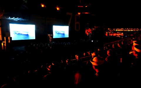 US Navy 071114-N-1635S-003 Sailors, family members and guests watch the world premier of