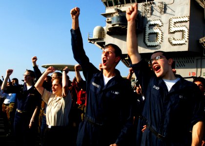 US Navy 071115-N-8132M-011 Sailors and Marines shout
