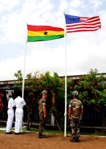 US Navy 071120-N-8933S-082 Ghanaian sailors and U.S. Seabees raise their country's colors at the Africa Partnership Station (APS) ground-breaking ceremony for the construction of a new medical clinic, which will be used by the