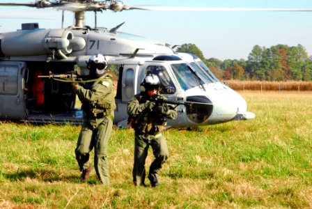 US Navy 071114-N-8704K-092 Aviation Warfare Systems Operator 3rd Class Rudy Perez and Chief Aviation Warfare Systems Operator Scott Chun, both assigned to Helicopter Sea Combat Squadron (HSC) 26, participate in a ground rescue