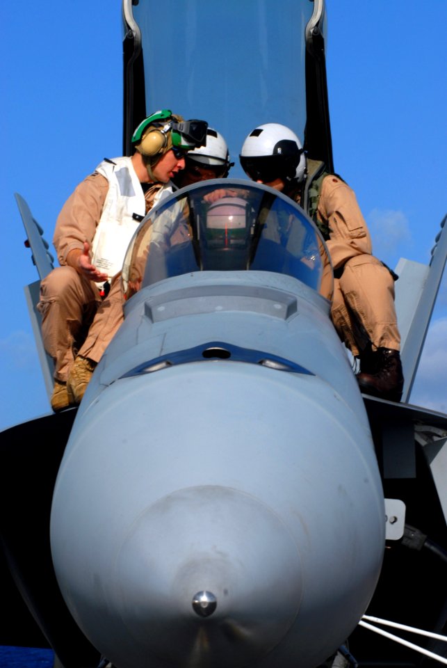 US Navy 071114-N-1688B-005 U.S. Navy pilots receive hands-on training in a F-A-18 Hornet for possible missions aboard the Nimitz-Class nuclear-powered aircraft carrier USS Harry S. Truman (CVN 75)