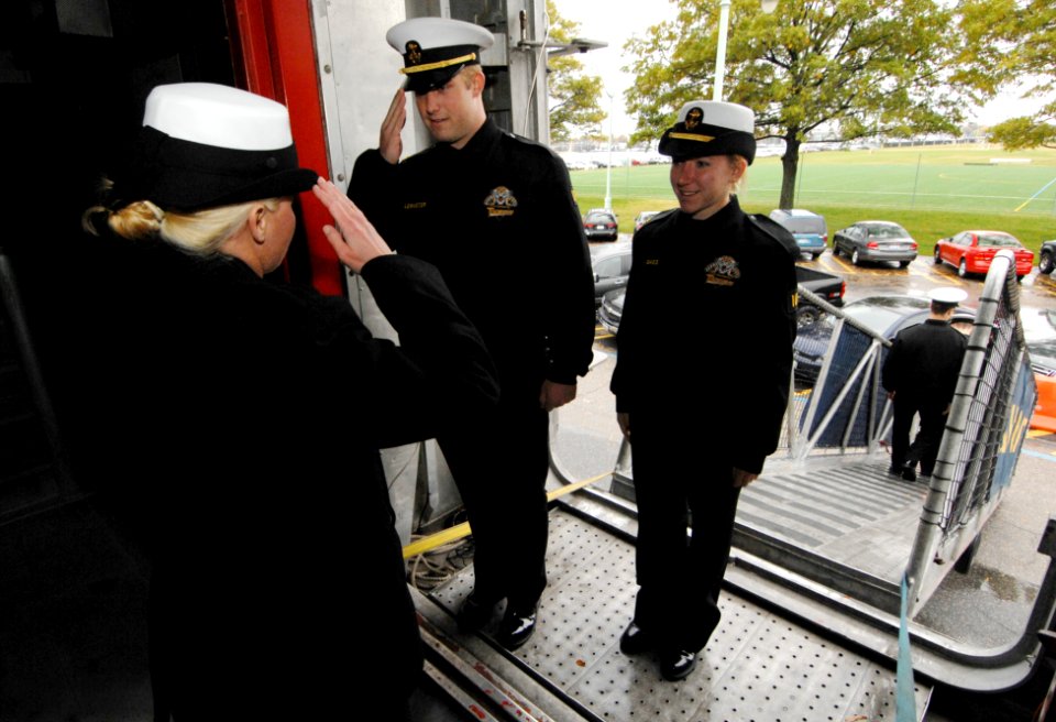 US Navy 071115-N-4308O-001 Mineman 1st class Rebecca Diehl returns a salute to a midshipman, giving him permission to come aboard the High Speed Vessel (HSV) 2 Swift. Swift