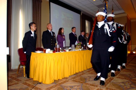 US Navy 071114-N-6676S-007 Members of Naval Station Norfolk's color guard exit after presenting the Colors during the start of the eighth annual GEICO Military Appreciation Day Luncheon at Naval Station Norfolk's Vista Point Co photo