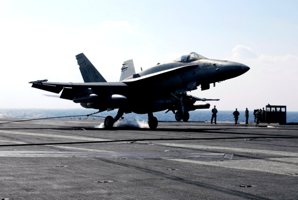 US Navy 071112-N-7883G-002 An F-A-18C Hornet, assigned to Strike Fighter Squadron (VFA) 192, lands on the aircraft carrier USS Kitty Hawk (CV 63)