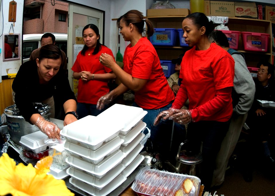 US Navy 071119-N-5253W-004 Members of the Commander Fleet Activities Yokosuka Multicultural Committee serve a hot meal at the Sanagi-tachi Homeless Shelter in Yokohama