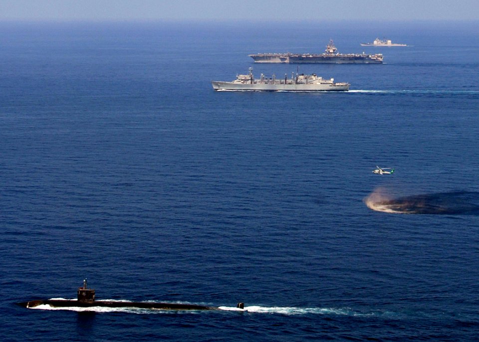 US Navy 071113-N-8132M-014 USS Miami (SSN 755) steams through the Arabian Sea accompanied by the USS Enterprise (CVN 65), USNS Supply (T-AOE 6), and USS Gettysburg (CG 64)
