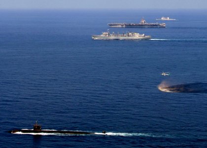 US Navy 071113-N-8132M-014 USS Miami (SSN 755) steams through the Arabian Sea accompanied by the USS Enterprise (CVN 65), USNS Supply (T-AOE 6), and USS Gettysburg (CG 64)