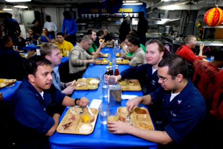 US Navy 071122-N-7883G-034 Sailors from USS Kitty Hawk (CV 63) and Carrier Air Wing Five enjoy Thanksgiving dinner