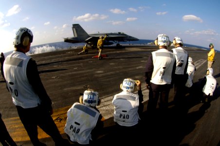 US Navy 071115-N-7883G-020 Japan Self-Defense Forces (JSDF) personnel observe an F-A-18C Hornet, assigned to Strike Fighter Squadron (VFA) 195, launch from the flight deck of the nuclear-powered aircraft carrier USS Kitty Hawk