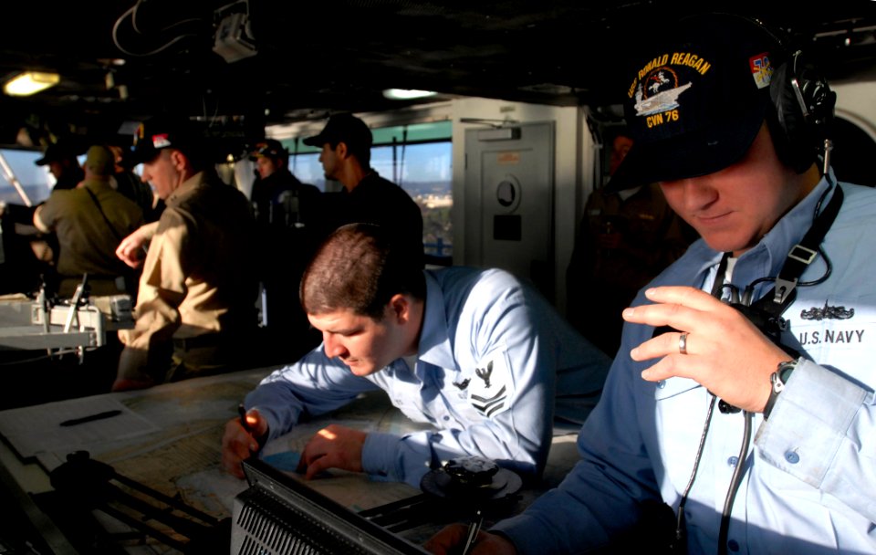 US Navy 071127-N-4776G-069 Sailors and officers stand watch on the navigation bridge of the Nimitz-class nuclear-powered aircraft carrier USS Ronald Reagan (CVN 76) as the ship navigates through San Diego Bay