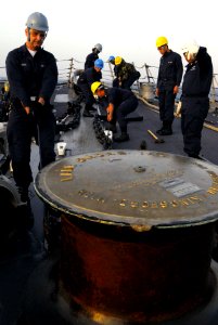 US Navy 071121-N-3136P-105 Deck Department Sailors work on the forecastle aboard guided-missile destroyer USS Mustin (DDG 89)