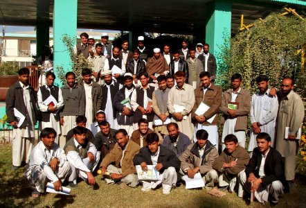 US Navy 071121-O-0000X-001 Khost University professors and students pose for a group picture after one of many seminars held by Provincial Reconstruction Team Khost during the course of their deployment in Afghanistan