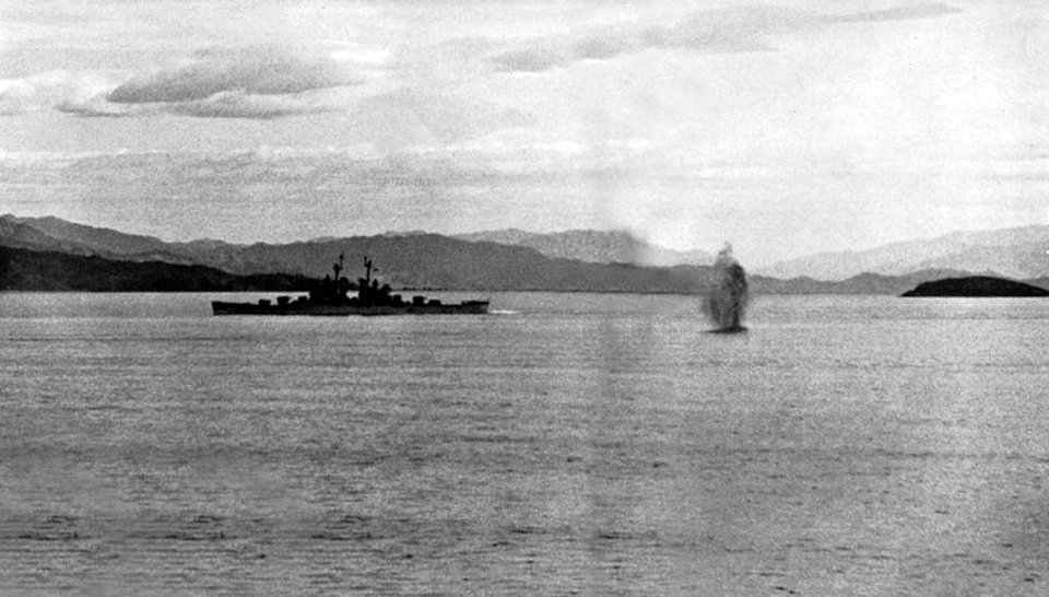 USS Bremerton (CA-130) under fire from North Korean shore batteries, in 1953