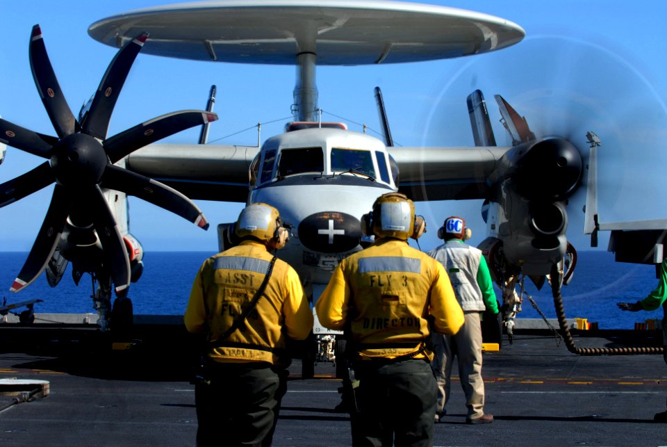 US Navy 071123-N-0684R-050 Flight deck directors watch as pilots of an E-2C Hawkeye assigned to the Golden Hawks of Carrier Airborne Early Warning Squadron One One Two (VAW-112) start-up their engines