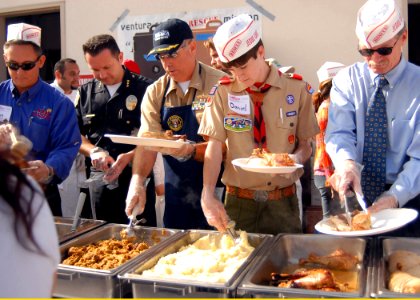 US Navy 071121-N-8607R-024 Capt. Stephen Huber, commanding officer of the Naval Surface Warfare Center Port Hueneme Division, along with the Oxnard Fire Department and Boy Scouts of America help serve food to the homeless at th