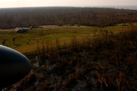 US Navy 071127-N-5642P-053 A CH-53E Sea Stallion helicopter approaches an open field being used as a landing zone photo