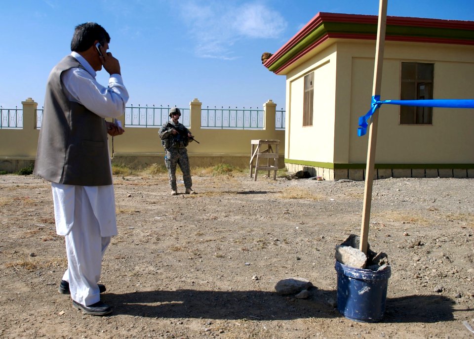US Navy 071121-N-3385W-106 Lt. Robert Holt, the executive officer of Provincial Reconstruction Team Khost, stands guard during the opening ceremony for an agricultural demonstration farm for Khost University