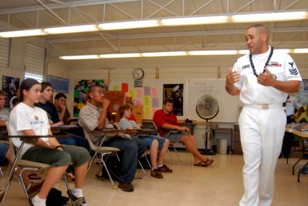 US Navy 071127-N-9758L-063 Navy Counselor 1st Class (SW-AW) Richard Stewart, assigned to Naval Station Pearl Harbor, speaks to students from Radford High School during the school's 10th annual Career Fair