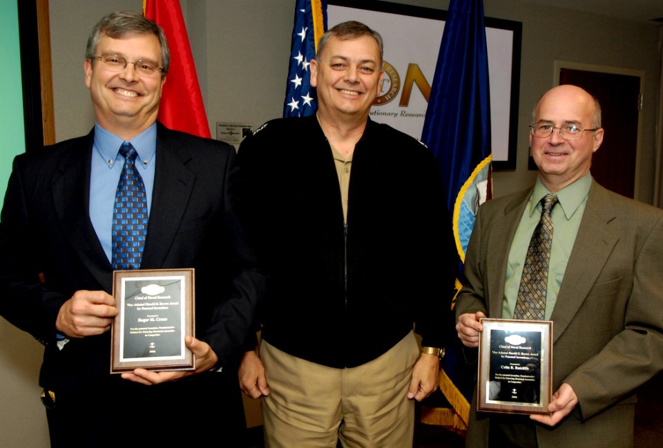 US Navy 071127-N-7676W-004 Rear Adm. William E. Landay III, Chief of Naval Research, presents the 2006 Vice Admiral Harold G. Bowen Award for Patented Inventions to Roger M. Crane, left, of the Naval Surface Warfare Center, Car