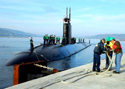 US Navy 071124-N-0780F-003 assist with mooring operations as the Los Angeles-class nuclear-powered submarine USS Montpelier (SSN 765) arrives pierside in Souda Harbor for a routine port visit