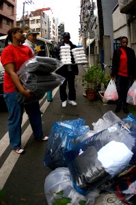 US Navy 071119-N-5253W-001 Members of the Commander, Fleet Activities Yokosuka Multicultural Committee deliver clothing, blankets and hot food to the Sanagi-tachi Homeless Shelter in Yokohama
