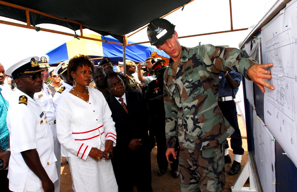 US Navy 071120-N-8933S-152 Builder 2nd Class Errol Browning, right, explains the plans of construction