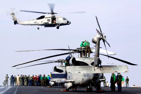 US Navy 071126-N-3136P-039 Helicopter Anti-Submarine Squadron (HS)14 Sailors stand on the bow aboard the aircraft carrier USS Kitty Hawk (CV 63) for a group photograph