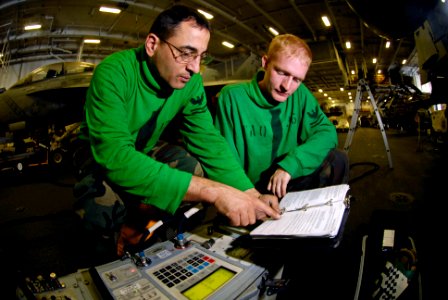 US Navy 071122-N-7883G-006 Aviation Electrician's Mate 2nd Class John Glynos, left, and Aviation Electrician's Mate 2nd Class Joshua Braswell calibrate an EA-6B Prowler assigned to Electronic Attack Squadron (VAQ) 136 aboard th