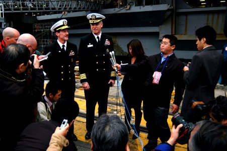 US Navy 071127-N-3136P-047 Rear Adm. Richard Wren, Commander Task Force 70, and Capt. Todd Zecchin, commanding officer of the aircraft carrier USS Kitty Hawk (CV 63) speak to the media during a homecoming celebration