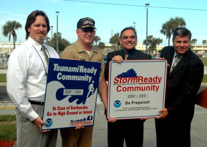 US Navy 071126-N-1522S-001 Capt. Aaron L. Bowman, Naval Station Mayport's commanding officer, second from left, receives the honors as the National Weather Service recognized the Naval Station as the nation's first Tsunami Read photo