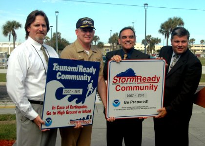 US Navy 071126-N-1522S-001 Capt. Aaron L. Bowman, Naval Station Mayport's commanding officer, second from left, receives the honors as the National Weather Service recognized the Naval Station as the nation's first Tsunami Read