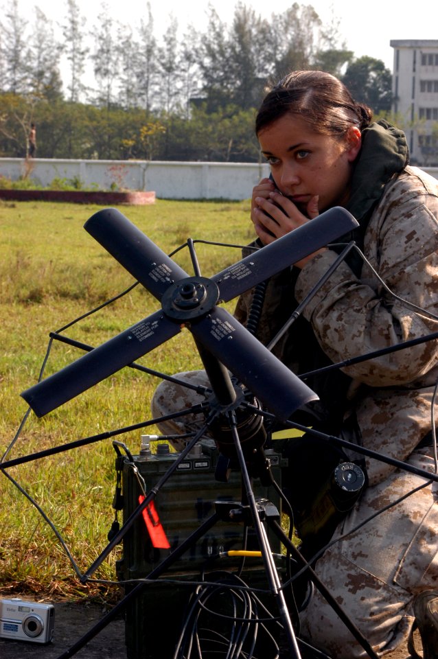 US Navy 071127-N-5642P-175 U.S. Marine Corporal Laura Buckingham, assigned of the 22nd Marine Expeditionary Unit (Special Operations Capable), which is embarked aboard USS Kearsarge (LHD 3), sets up a satellite