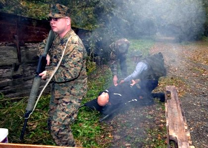 US Navy 071130-N-8534H-002 Hospital Corpsman 2nd Class Michael Bennett provides cover for the photo