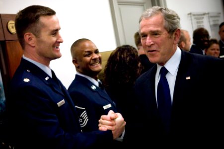 US Navy 071129-N-0696M-187 President George W. Bush greets service members and employees at the Pentagon after a meeting with senior leaders discussing long-term strategic plans for the military photo