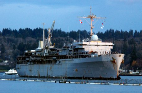 US Navy 071129-N-2143T-001 Submarine tender USS Emory S. Land (AS 39) pulls into its new homeport at Naval Base Kitsap Bremerton. Land's arrival from La Maddalena, Italy photo