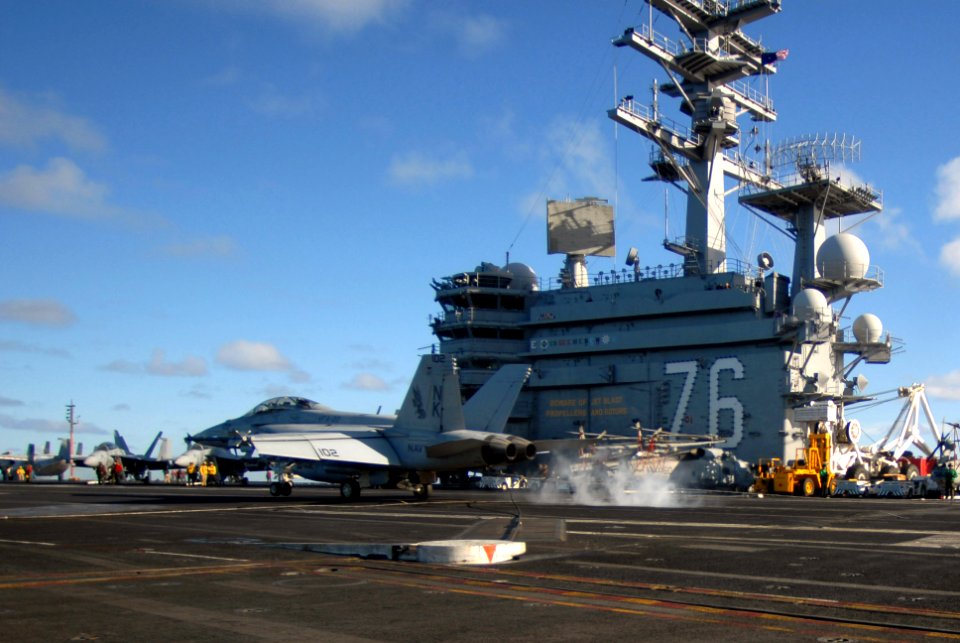 US Navy 071202-N-2959L-557 F-A-18F Super Hornet lands on the flight deck of the Nimitz-class nuclear-powered aircraft carrier USS Ronald Reagan (CVN 76)