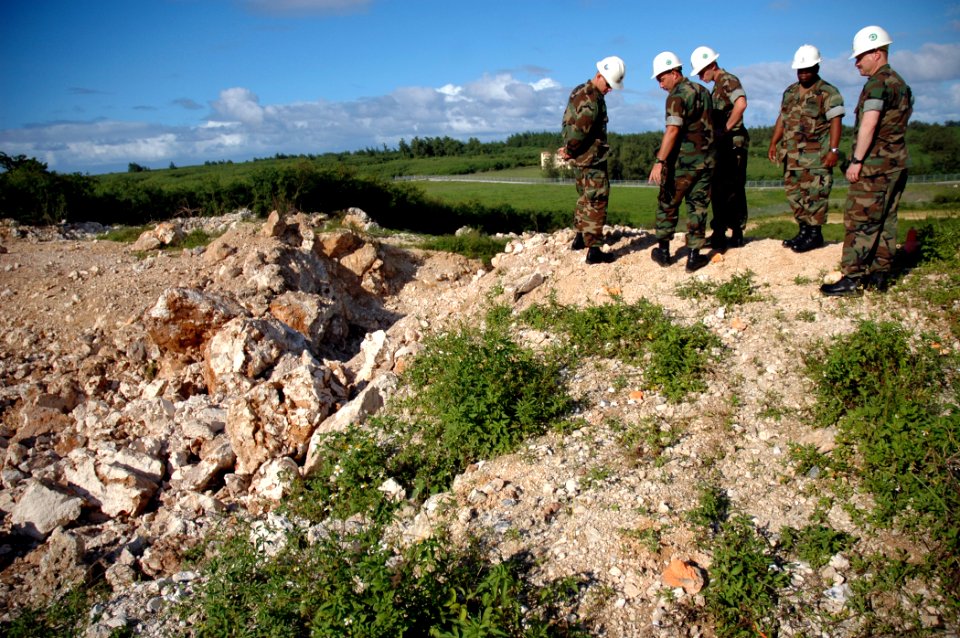 US Navy 071201-N-7367K-003 Seabees with U.S. Naval Mobile Construction Battalion (NMCB) 1, Guam Det., and the 30th Naval Construction Regiment examine the Orote Point rock quarry on board Naval Base Guam